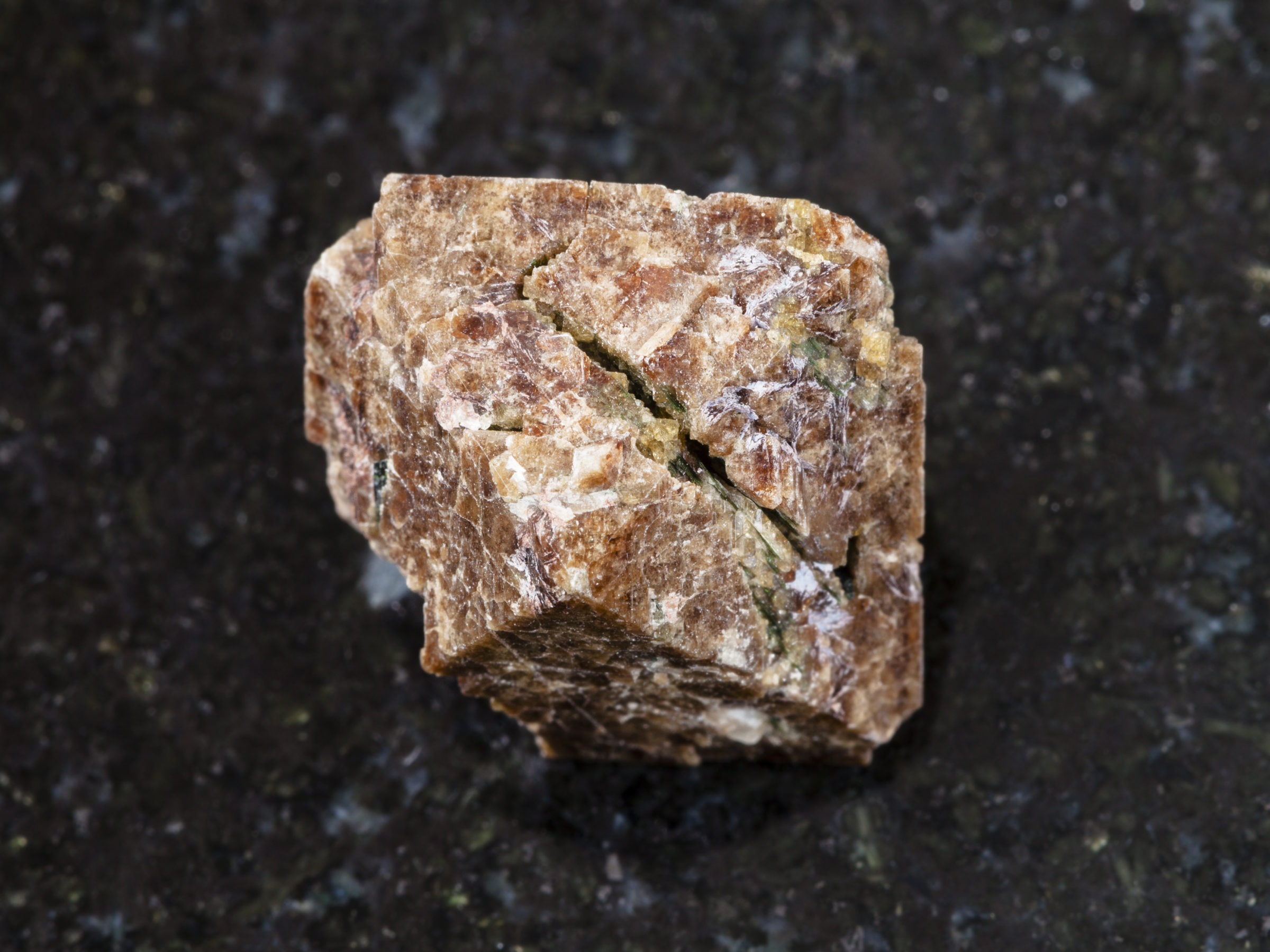 crystal of Zircon gemstone on dark background