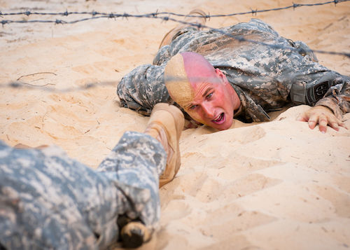 A_U.S._Army_soldier_slithers_through_a_sand_pit_on_the_Air_Assault_School_obstacle_course_at_Fort_Bragg,_N.C_130919-A-FV376-025.jpg