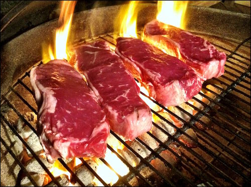 Grilling_Steaks_(with_border).jpg
