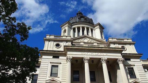 South_Dakota_State_Capitol_front_with_clouds.jpg